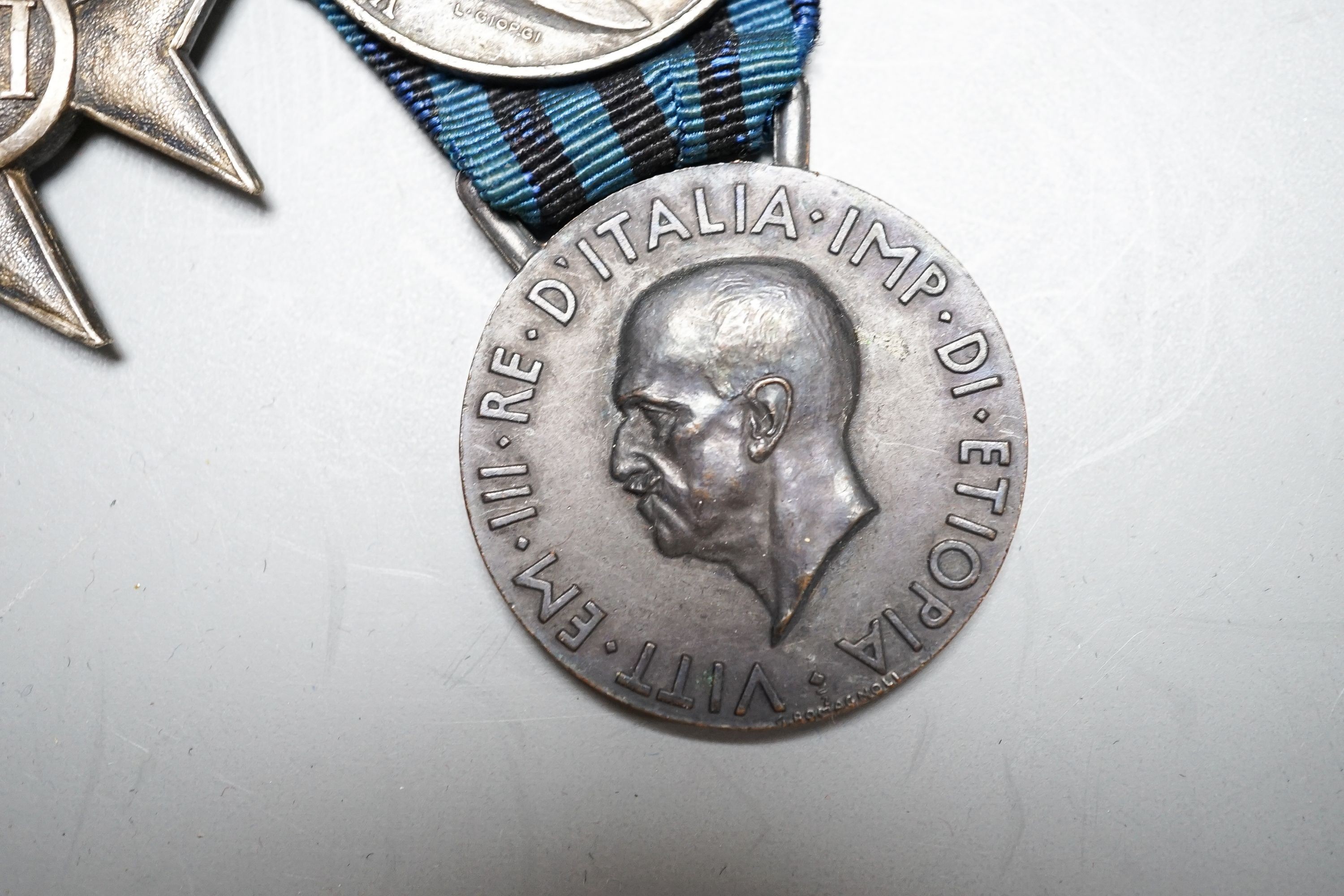 An Italian WWI medal group of six, including War Cross, War of Italian independence 1915–18 with four clasps, Libya 1911, United Italy 1848-1918, Ethiopian campaign 1935 and Army long service medal